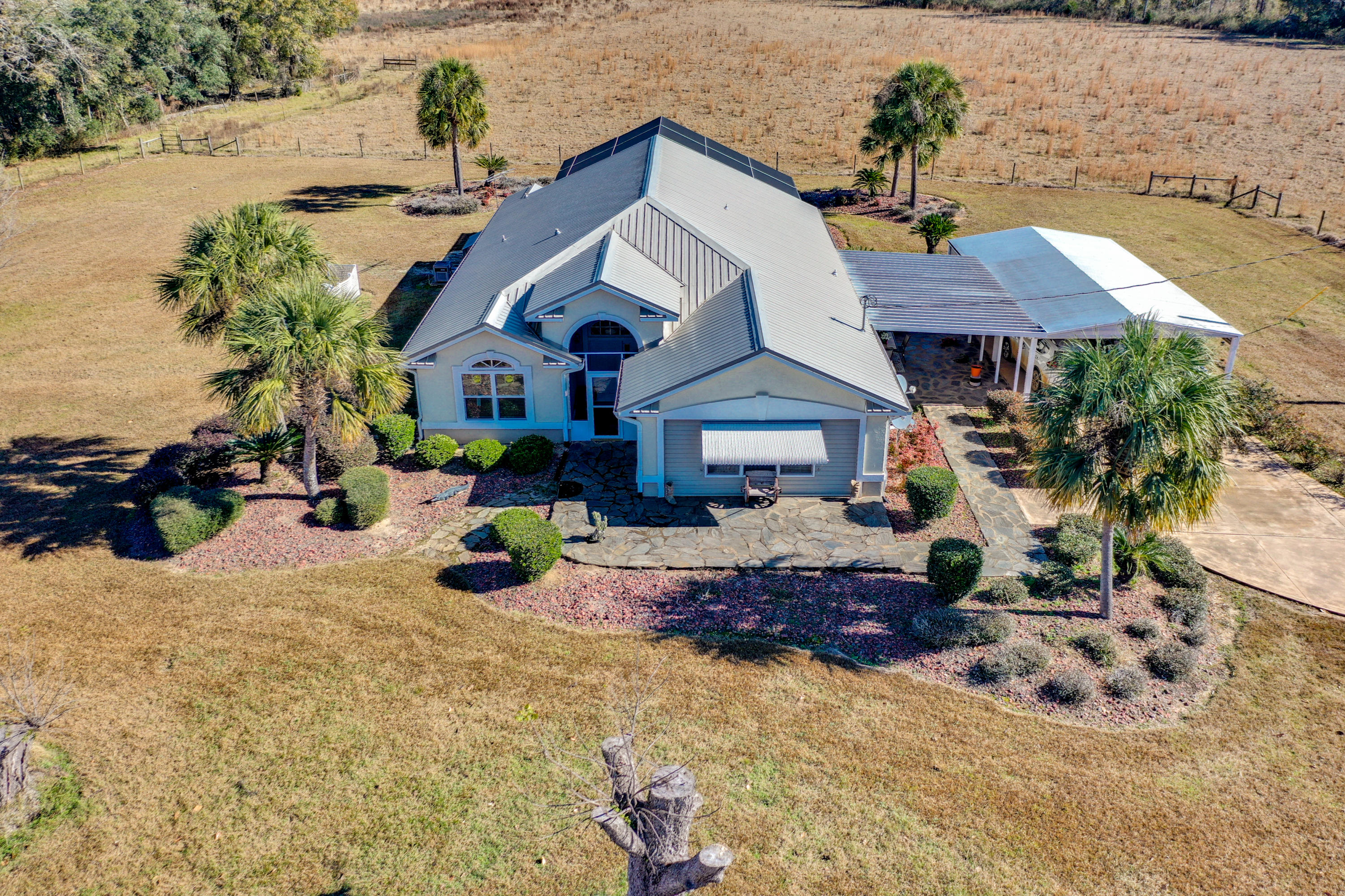 1940 Eldridge Road Cottondale, FL 32431 - Photo 1 of 42 a front view of a house with yard and sitting area