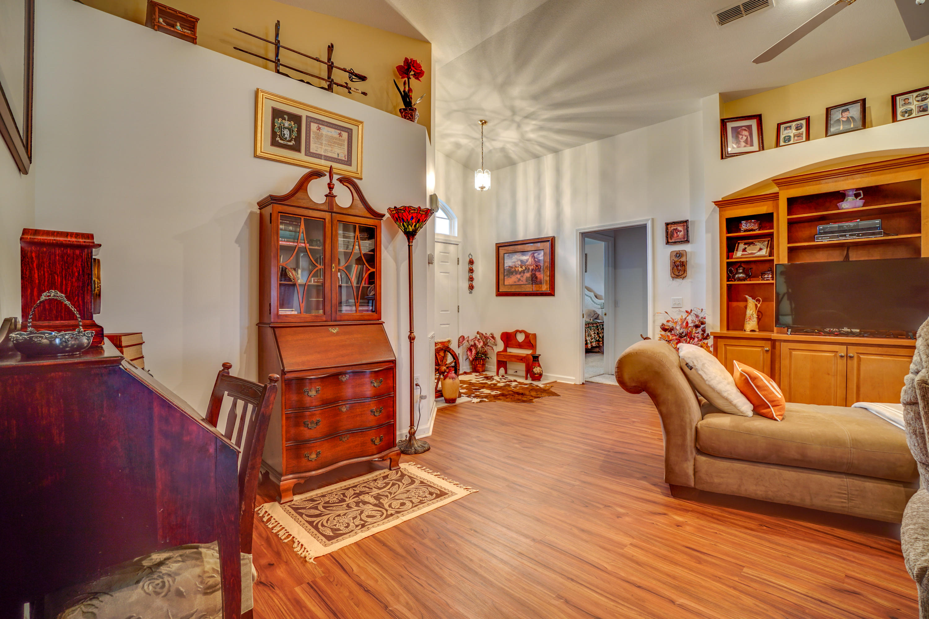 1940 Eldridge Road Cottondale, FL 32431 - Photo 13 of 42 a blue room with wooden floor and furniture
