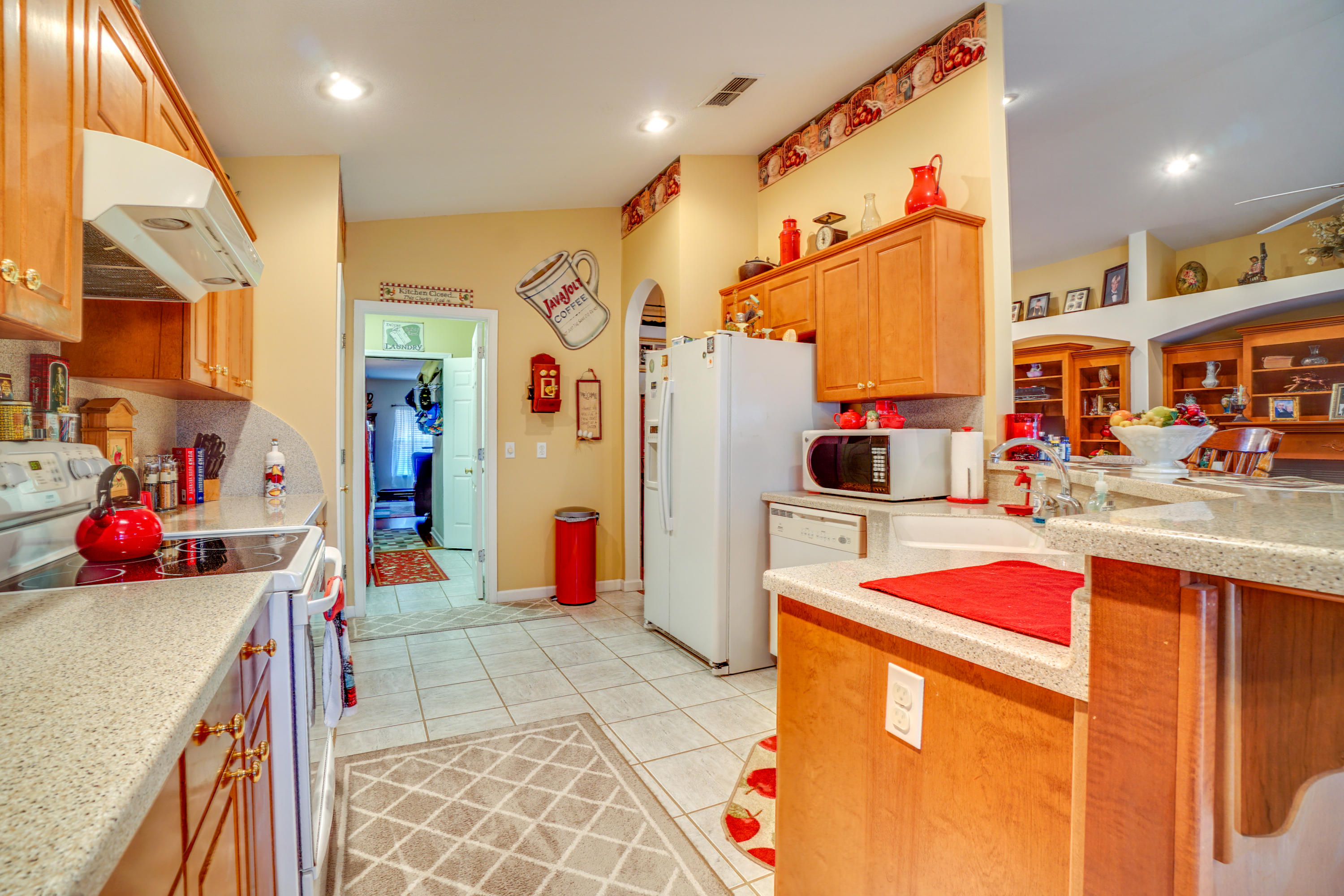 1940 Eldridge Road Cottondale, FL 32431 - Photo 20 of 42 a utility room with stainless steel appliances kitchen island granite countertop a sink and cabinets