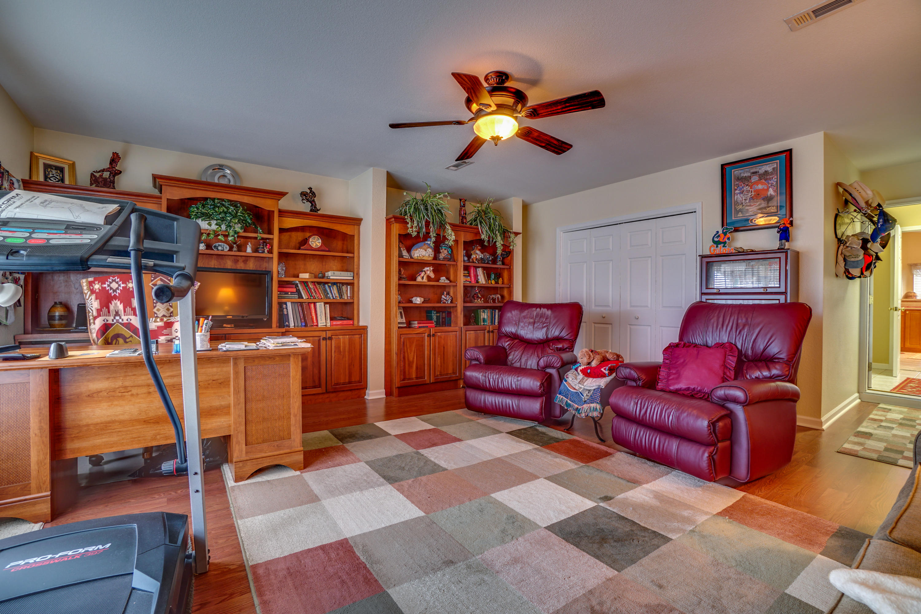 1940 Eldridge Road Cottondale, FL 32431 - Photo 24 of 42 a living room with furniture a rug and a fan