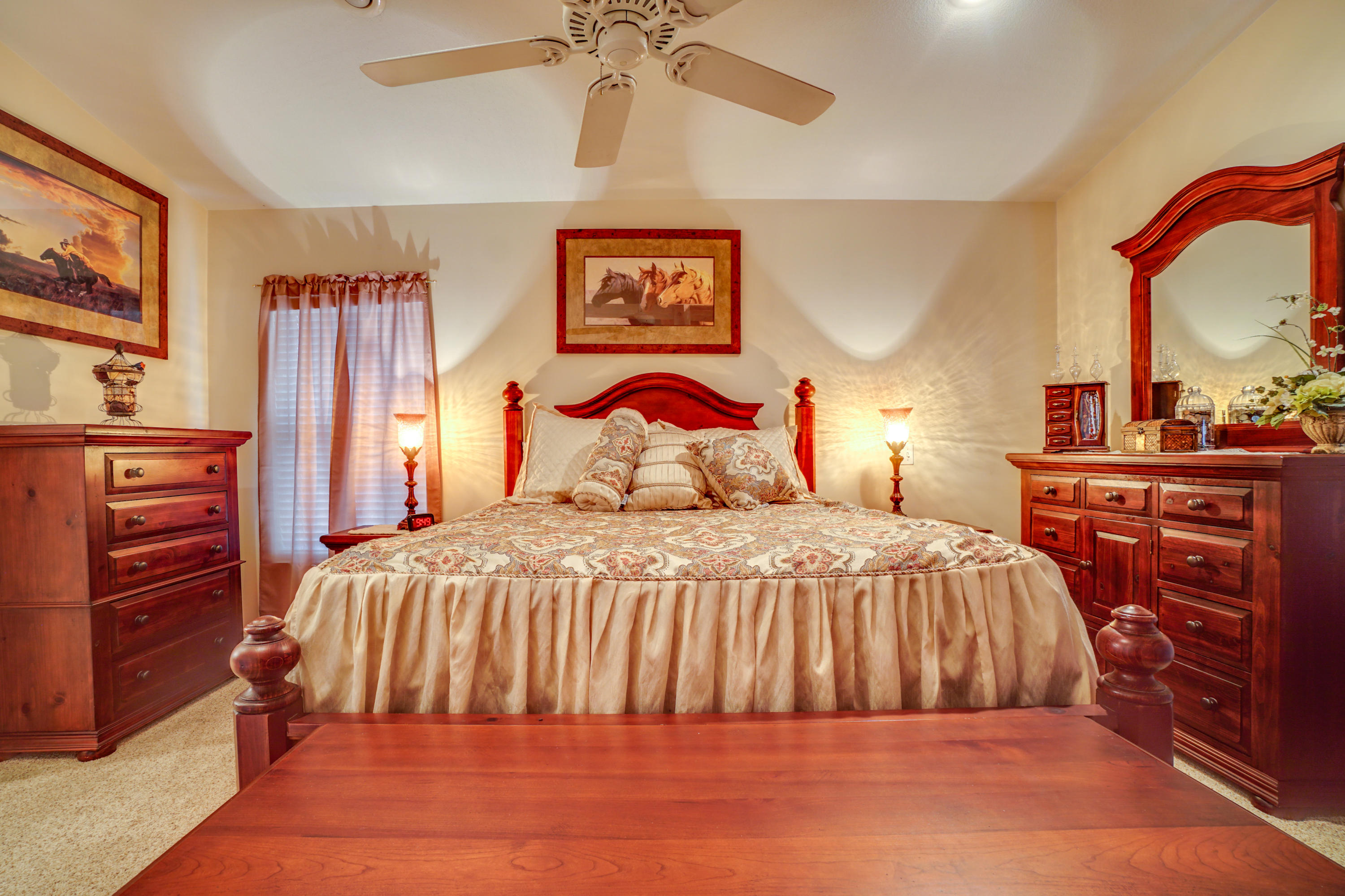 1940 Eldridge Road Cottondale, FL 32431 - Photo 27 of 42 a bedroom with a bed and wooden floor