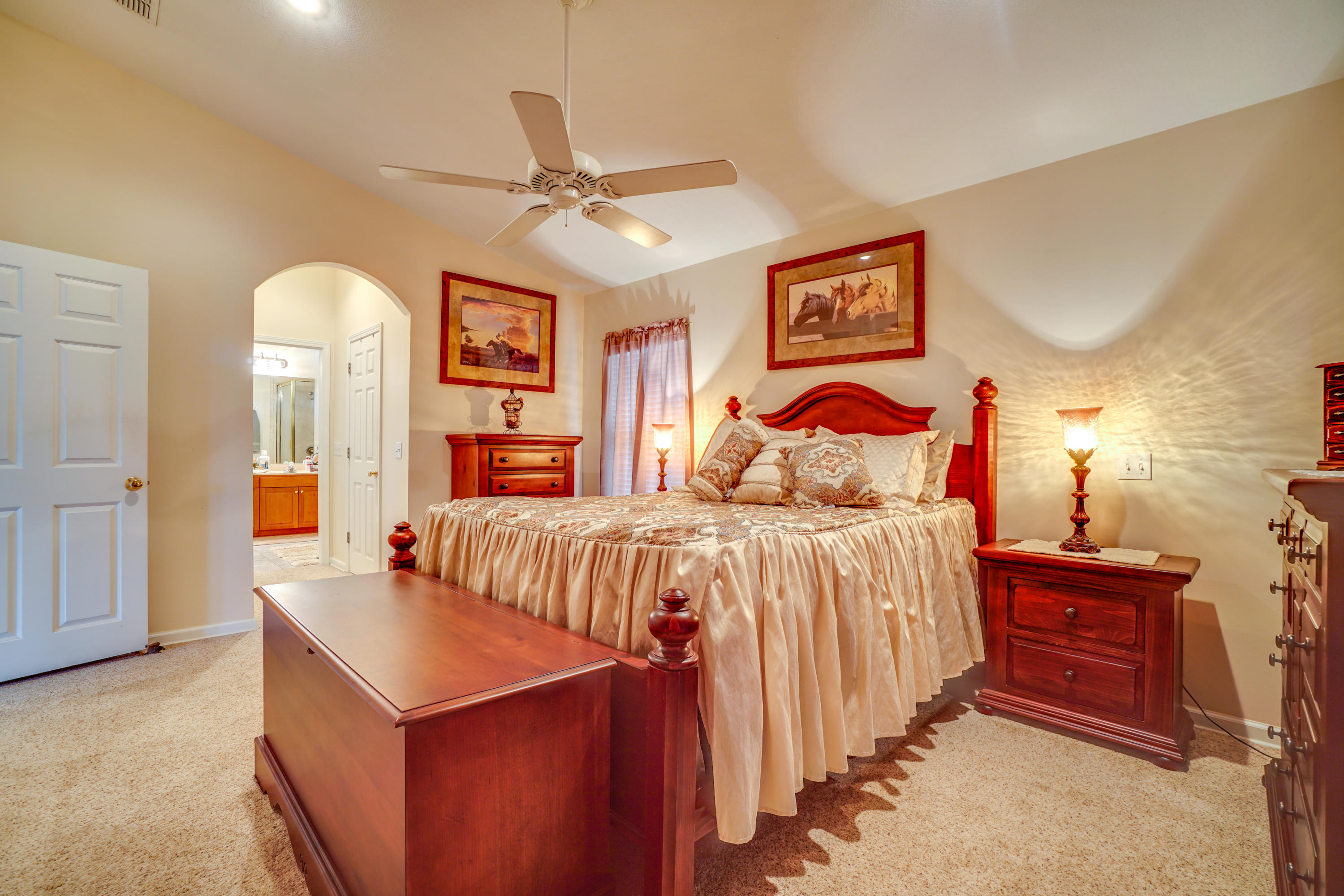 1940 Eldridge Road Cottondale, FL 32431 - Photo 28 of 42 a bedroom with a bed and a chandelier