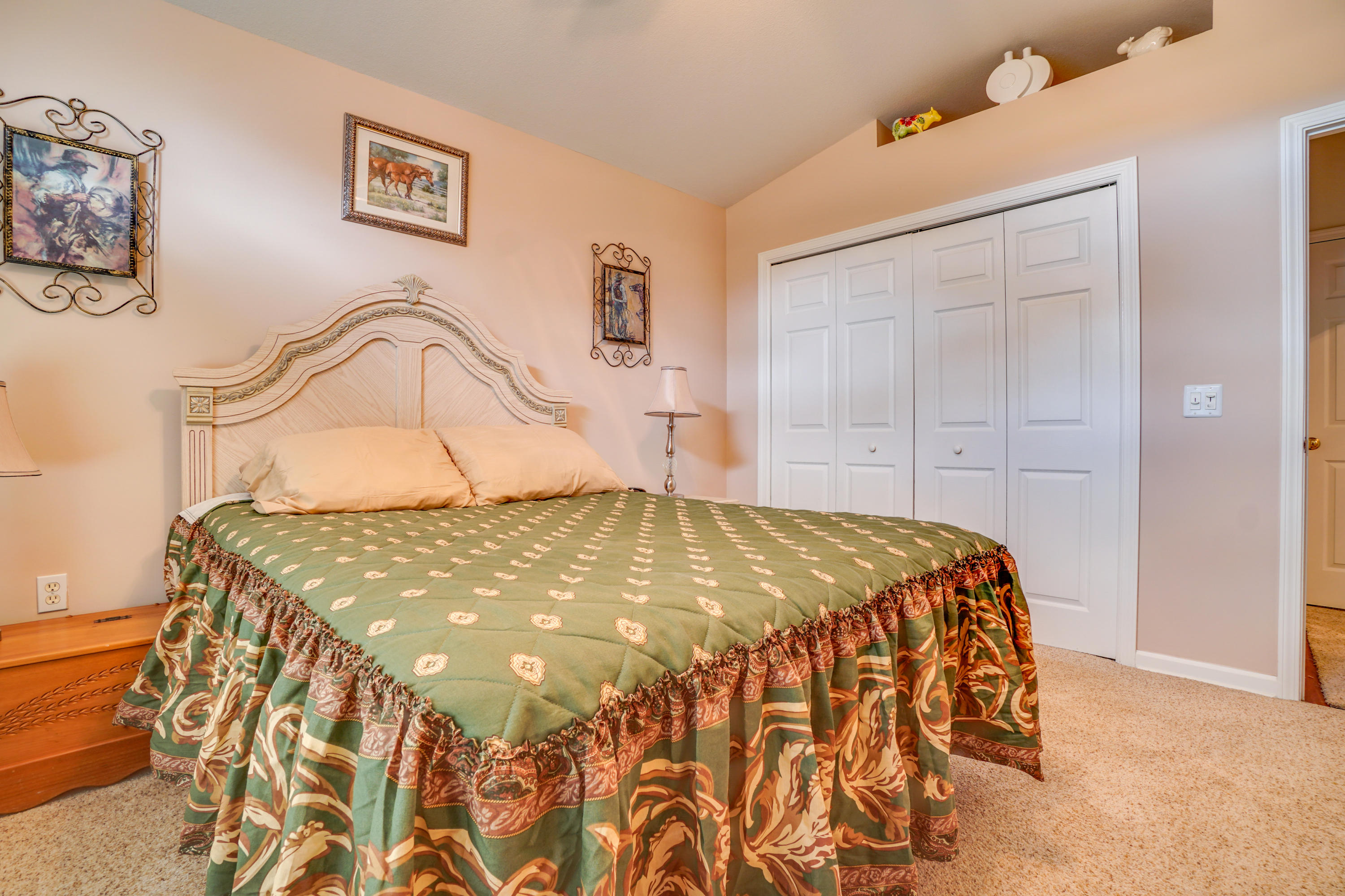 1940 Eldridge Road Cottondale, FL 32431 - Photo 33 of 42 a bedroom with a bed and painting on the wall
