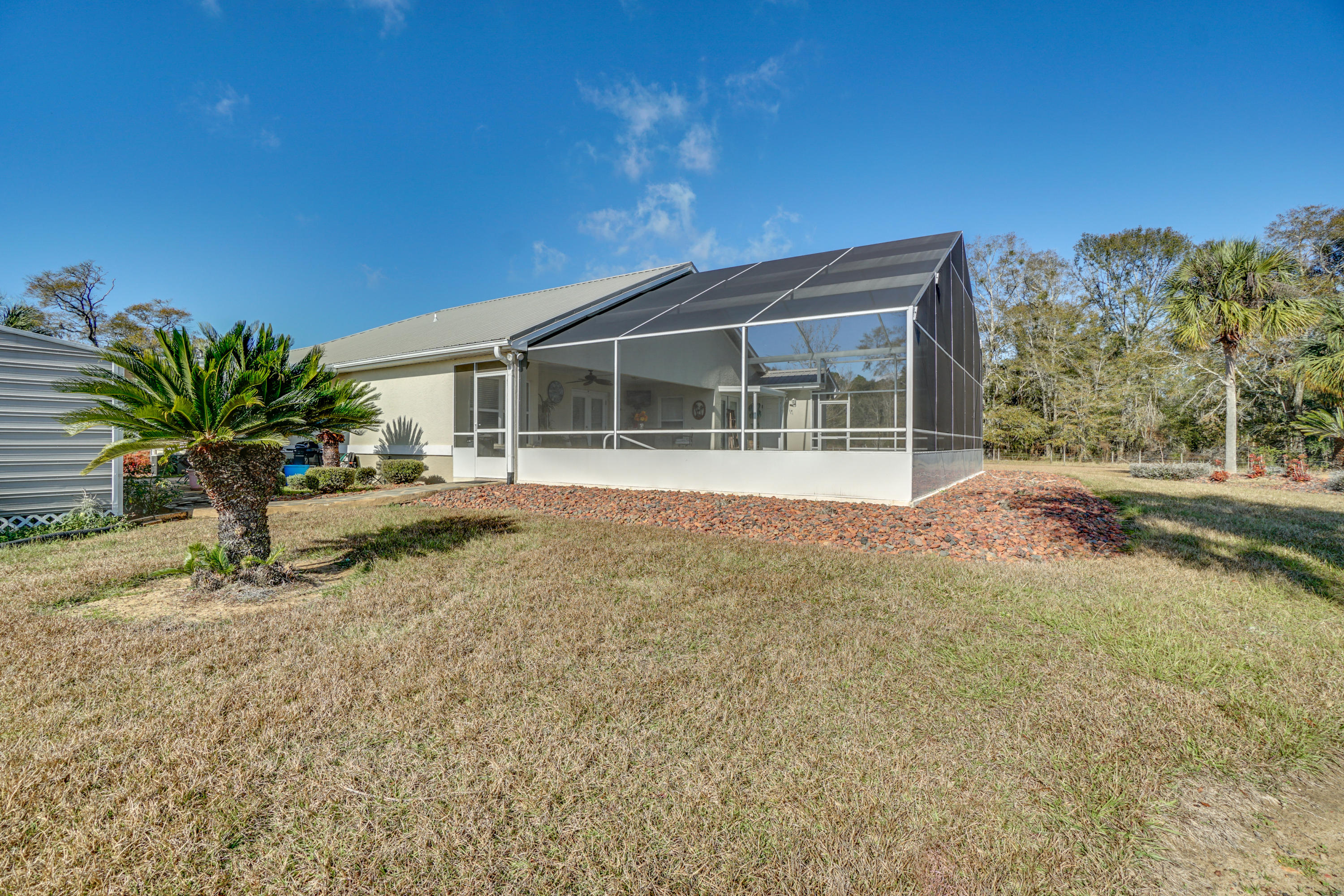1940 Eldridge Road Cottondale, FL 32431 - Photo 37 of 42 a house with trees in the background