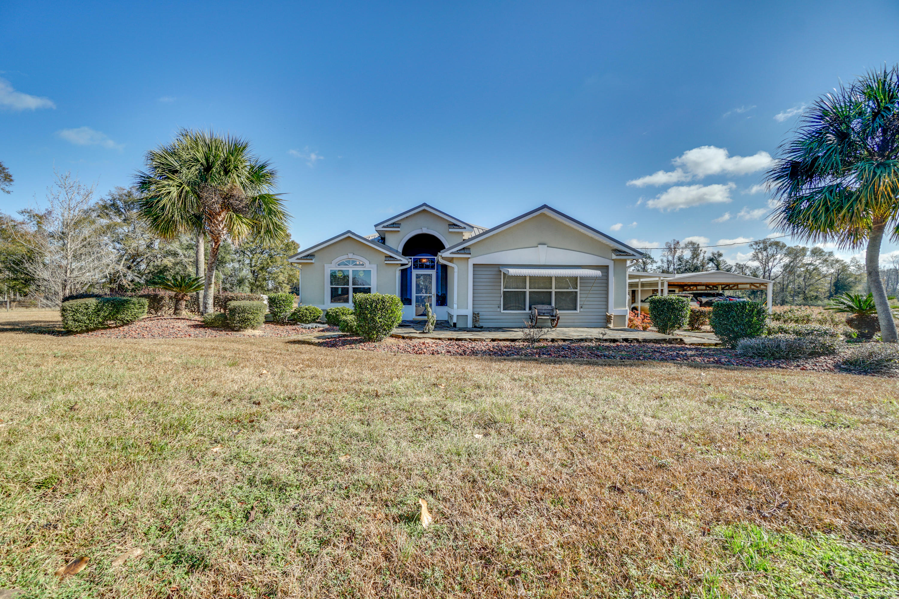 1940 Eldridge Road Cottondale, FL 32431 - Photo 7 of 42 a front view of house with yard and trees around