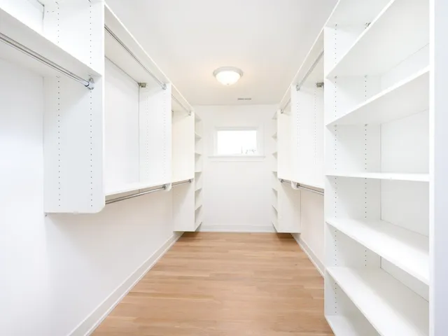 a view of a kitchen with wooden floor and staircase