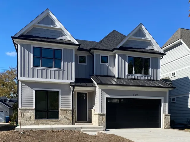 a front view of a house with a garage