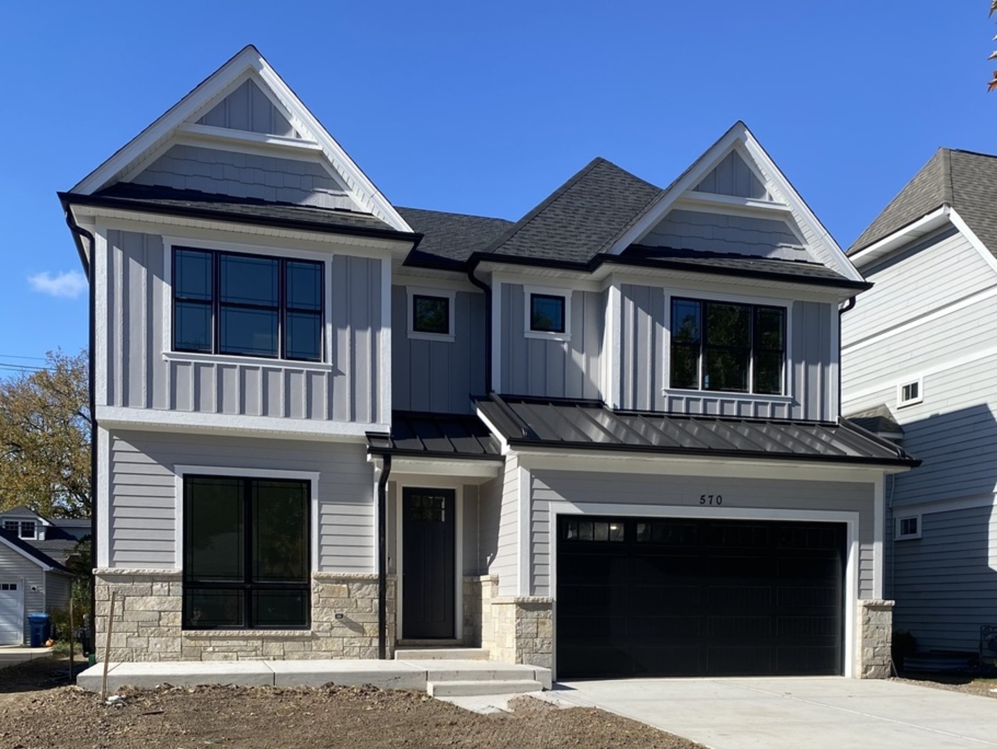 570 Parkside Avenue Elmhurst, IL 60126 - Photo 2 of 22 a front view of a house with a garage