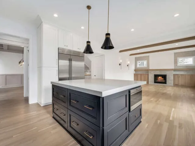a kitchen with a stove and a refrigerator