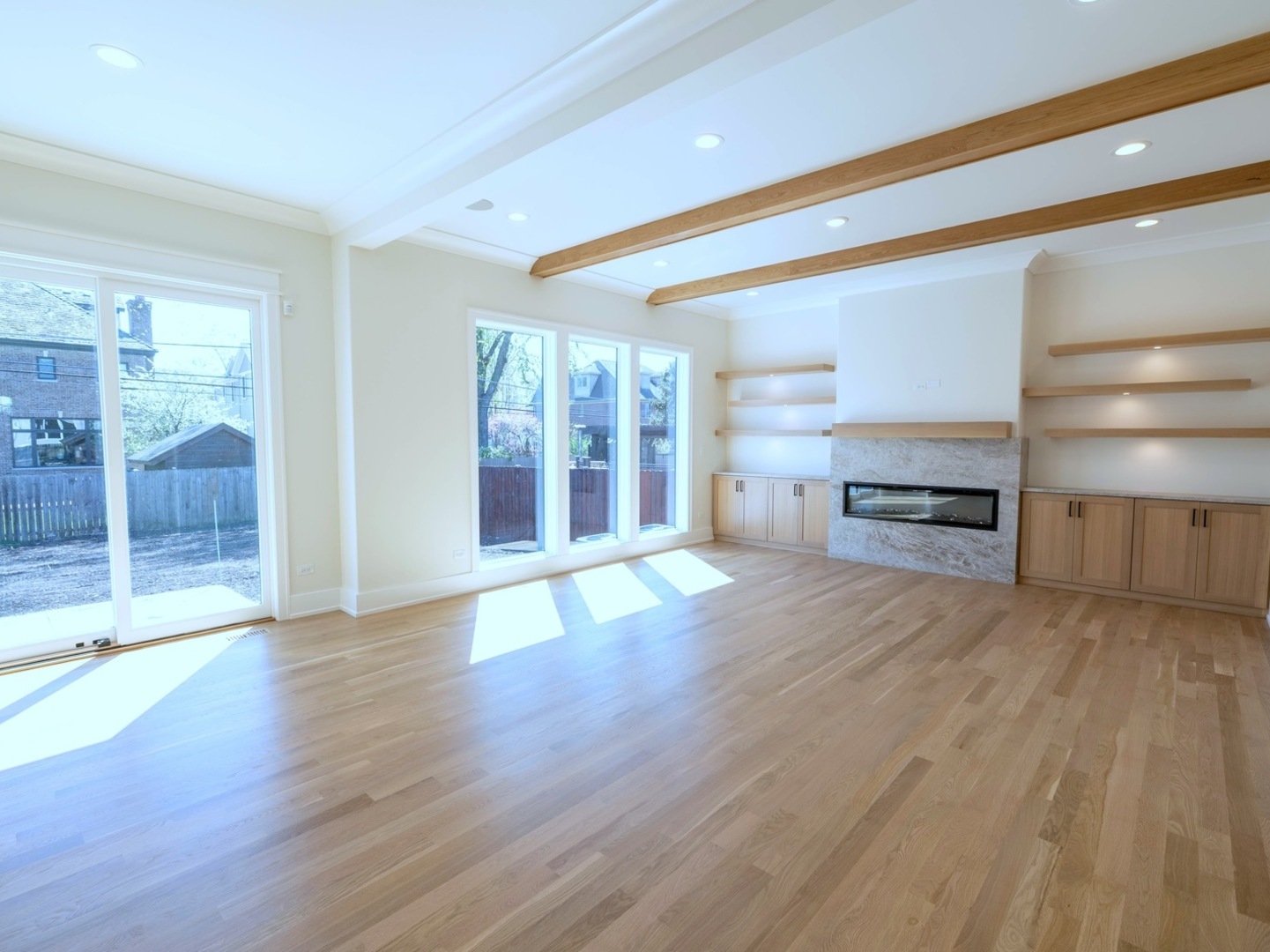 570 Parkside Avenue Elmhurst, IL 60126 - Photo 10 of 22 a view of empty room with wooden floor and fireplace