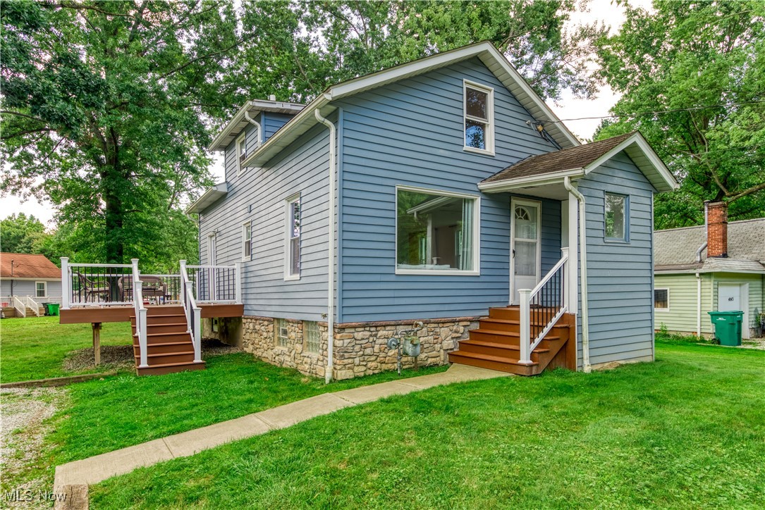 View of front facade featuring a deck and a front porch