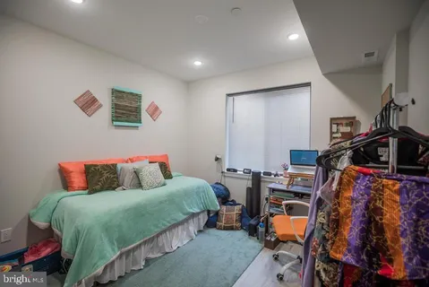 a bedroom with a bed and a closet