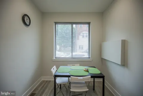 a view of a room that has a table and chair