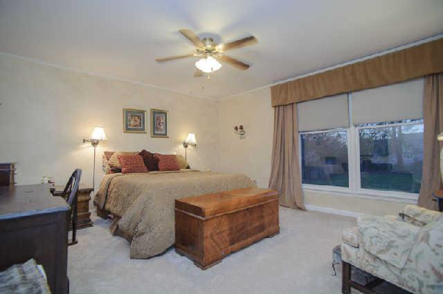 112 Jamestown Road Tullahoma, TN 37388 - Photo 13 of 20 First level spacious master bedroom with new carpet, a walk in closet and remodeled bath with oversized shower.