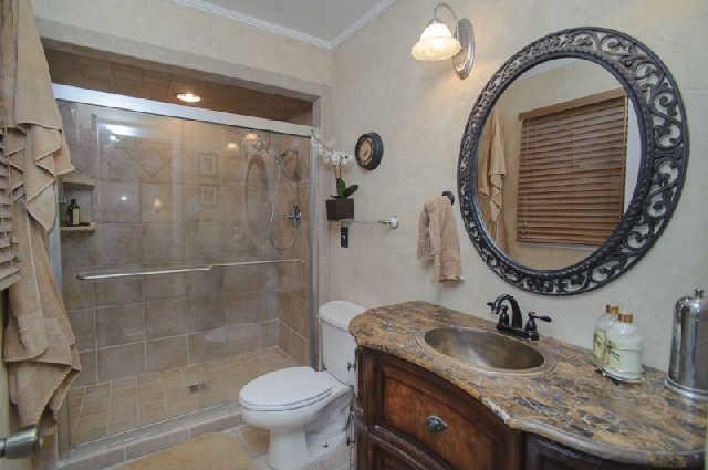 112 Jamestown Road Tullahoma, TN 37388 - Photo 14 of 20 Remodeled master bath with oversized tile shower, tile flooring, & decorative vanity with granite counter top.