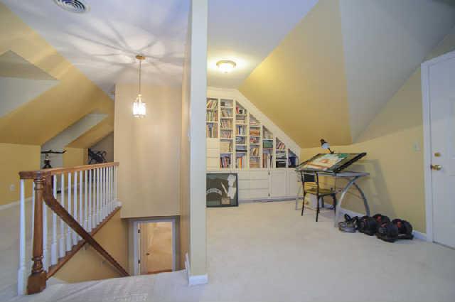 112 Jamestown Road Tullahoma, TN 37388 - Photo 16 of 20 Work at home and need a place for an office, then this nook off of the den/media room would be perfect. Notice the full size door to the floored walk out attic storage over the garage. Tons of storage space!