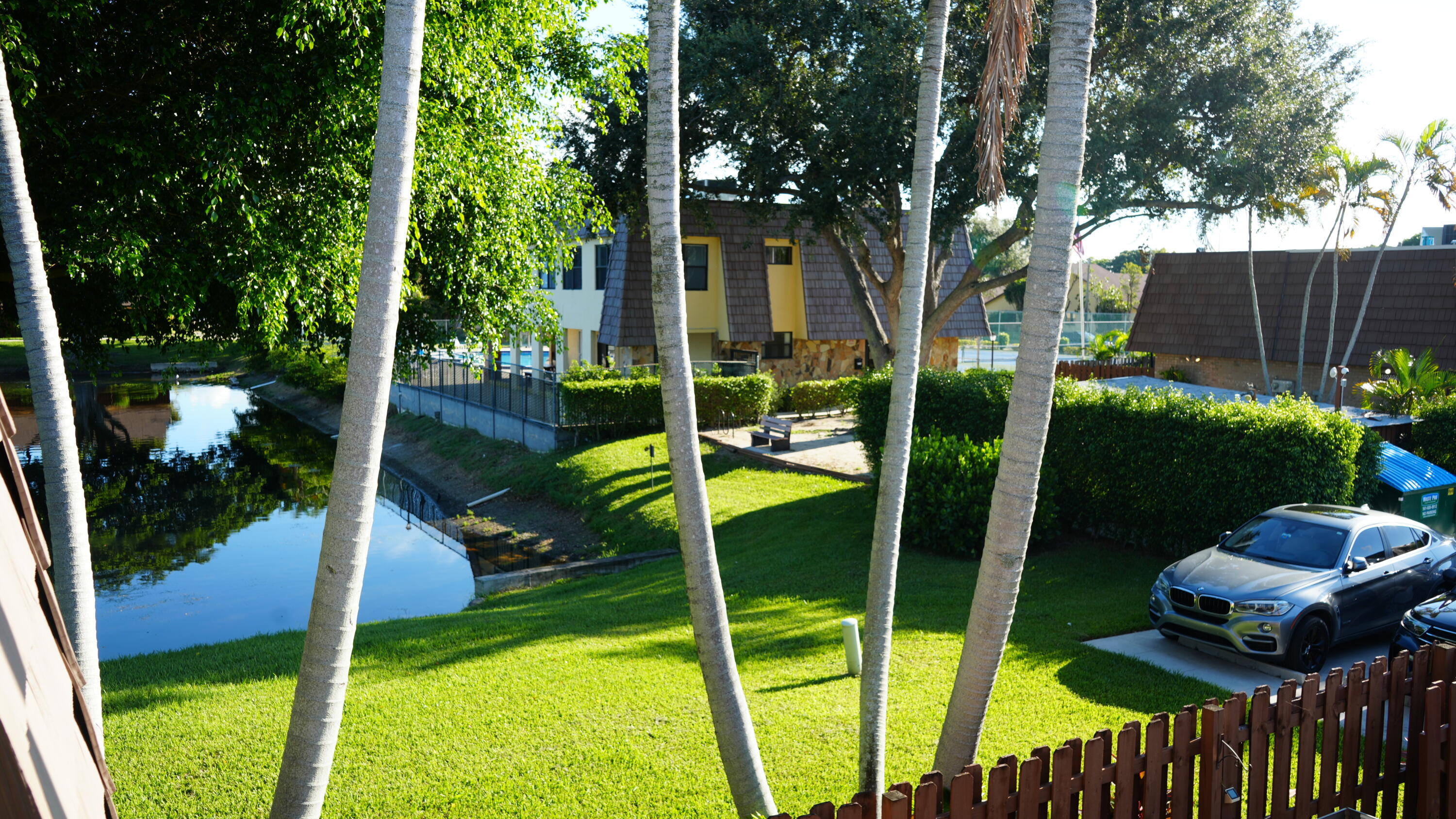 622 Springdale Circle Palm Springs, FL 33461 - Photo 5 of 13 a view of a chair and table in the garden
