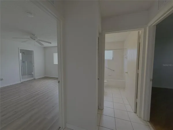a view of an empty room with a window