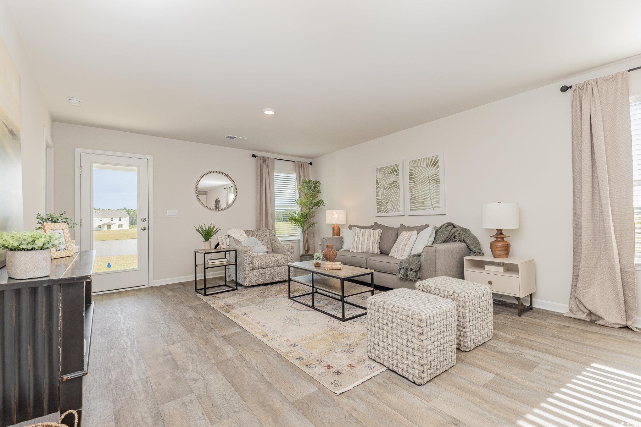 284 Long Beard Way Loris, SC 29569 - Photo 6 of 40 Living area with light wood-style floors and recessed lighting