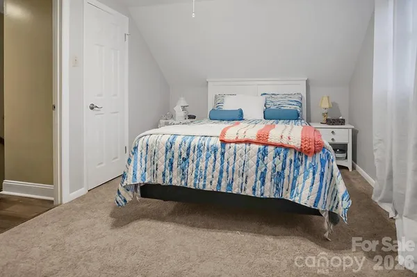 a bedroom with a bed and a cabinets