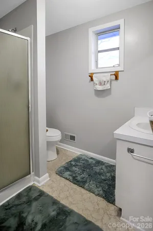 a bathroom with a toilet and a sink