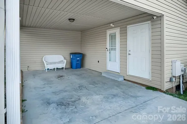 a view of backyard with seating space