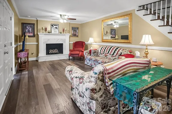 a bedroom with furniture and a fireplace