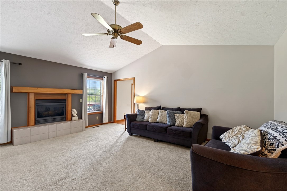 4996 Shannon Avenue Springfield, OH 45504 - Photo 19 of 61 This inviting living space features a cozy fireplace and abundant natural light.