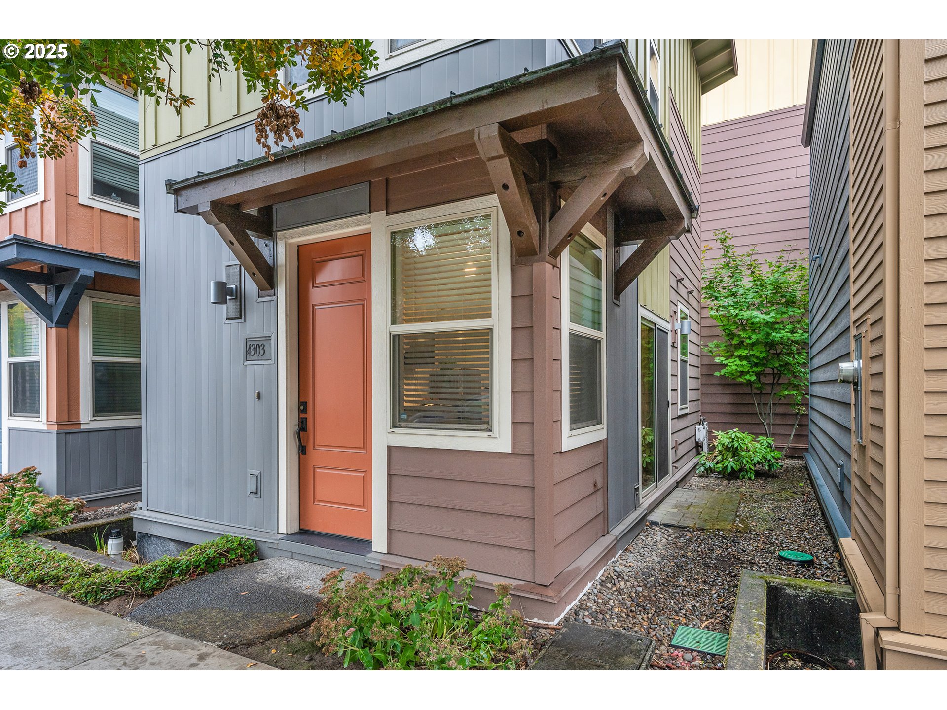4303 Southeast Division Street Portland, OR 97206 - Photo 1 of 40 a view of a back yard of the house
