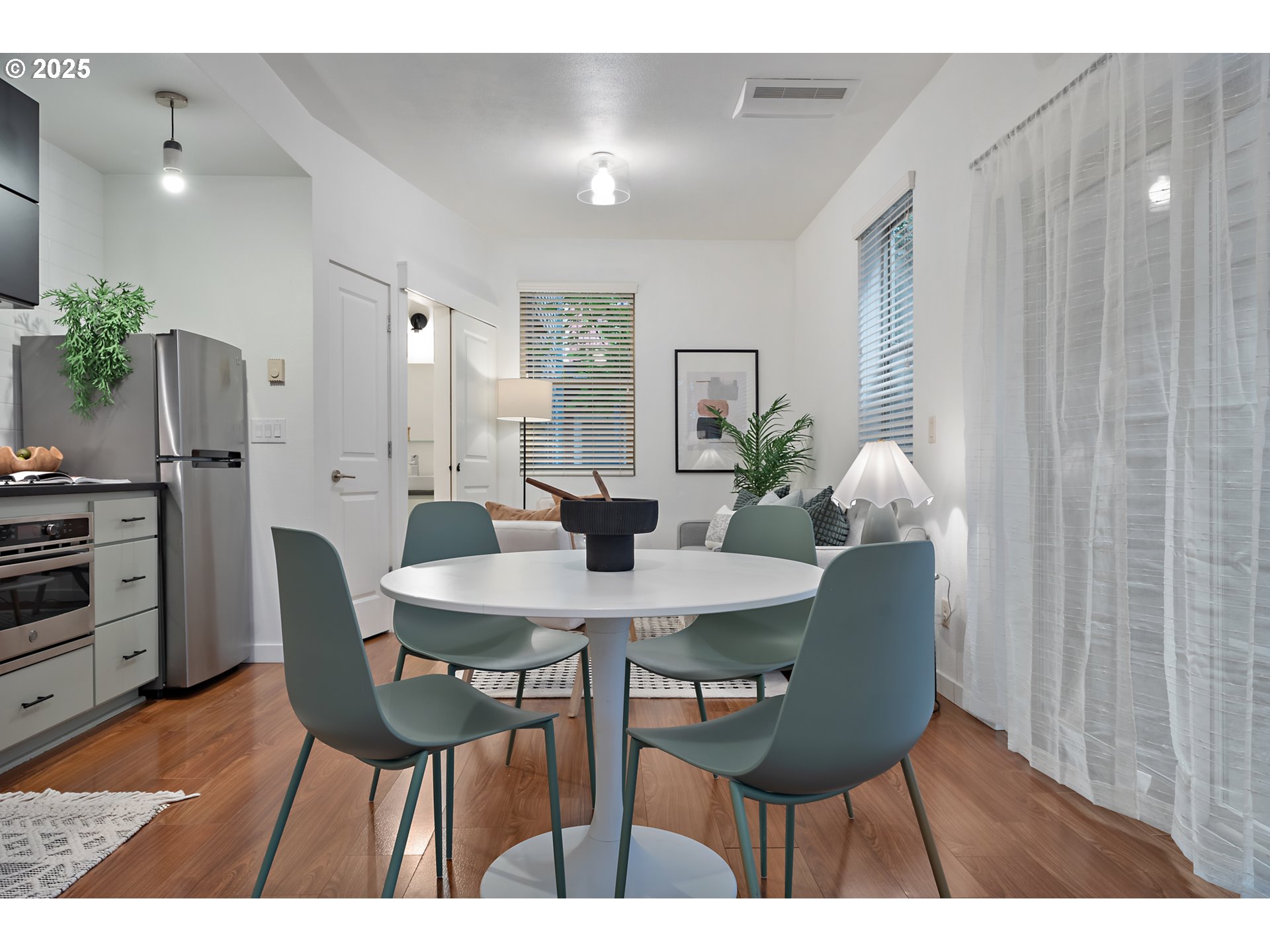 4303 Southeast Division Street Portland, OR 97206 - Photo 13 of 40 a view of a dining room with furniture and wooden floor