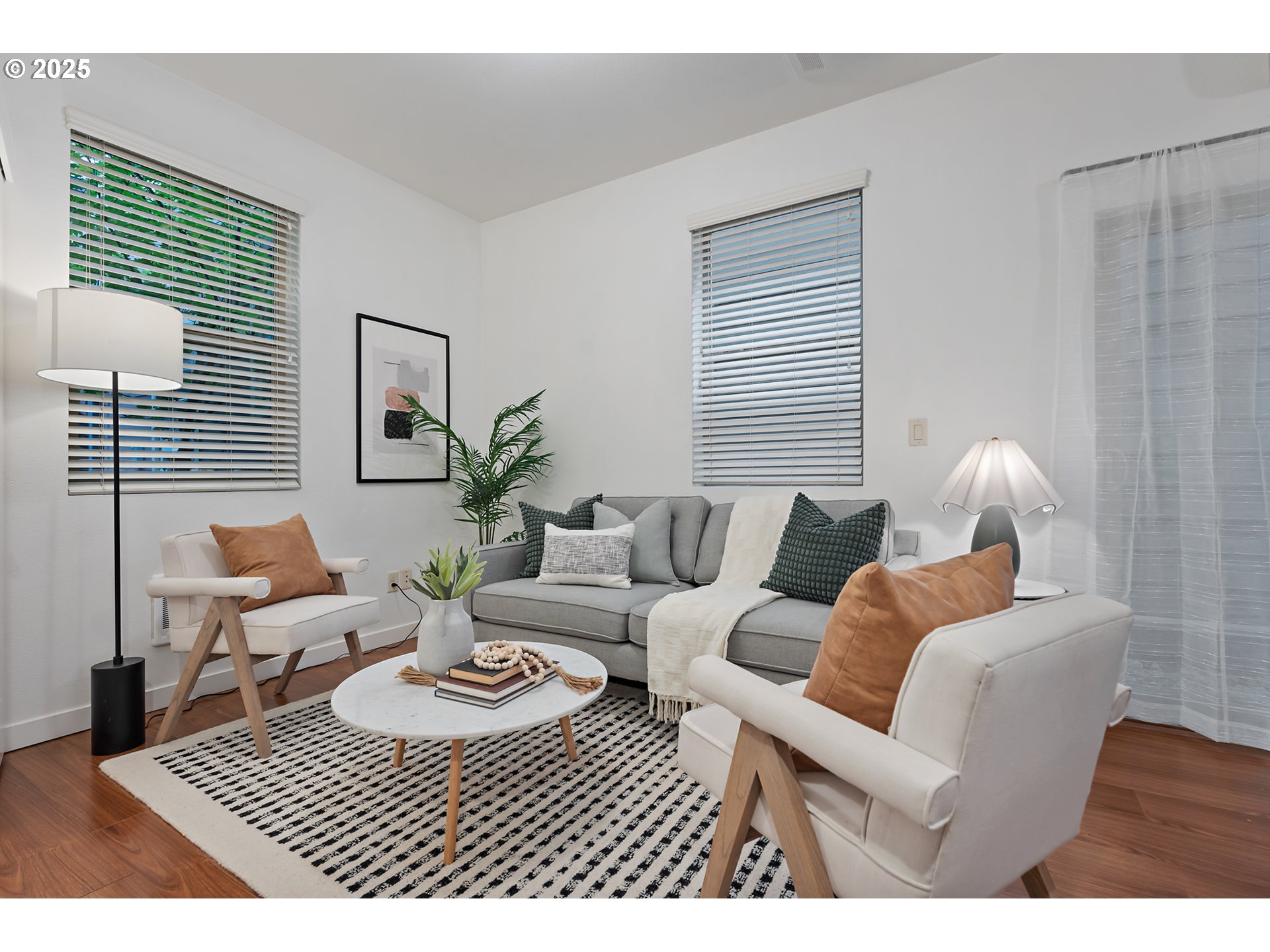 4303 Southeast Division Street Portland, OR 97206 - Photo 19 of 40 a living room with furniture a rug potted plant and a window