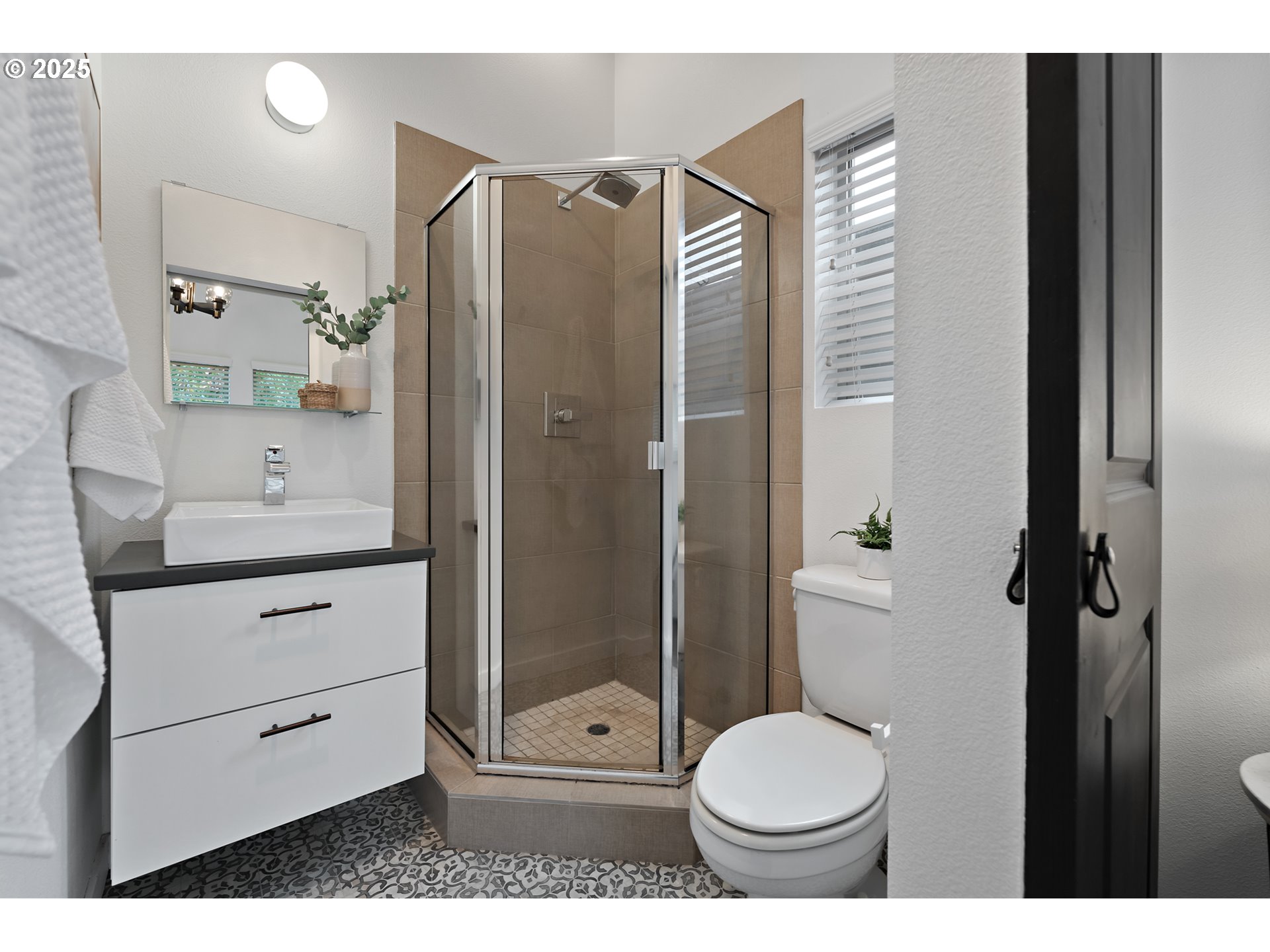 4303 Southeast Division Street Portland, OR 97206 - Photo 24 of 40 a bathroom with a toilet a sink and glass door