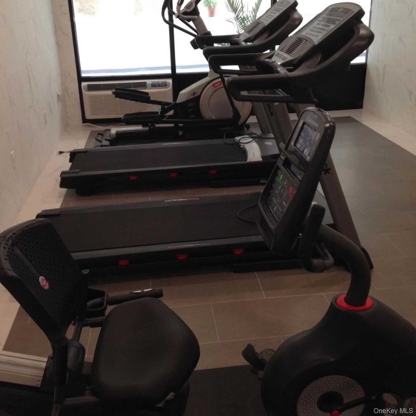 5 Grace Avenue, Unit 2J Great Neck, NY 11021 - Photo 1 of 15 a view of a room with gym equipment
