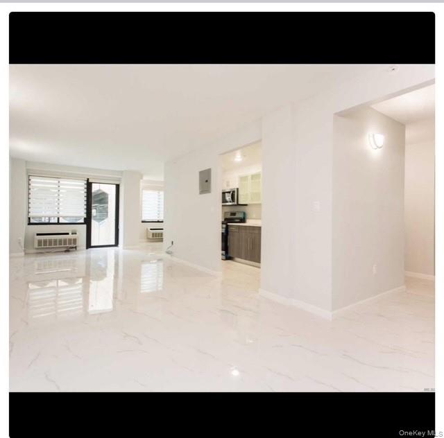 5 Grace Avenue, Unit 2J Great Neck, NY 11021 - Photo 11 of 15 a view of kitchen living room and kitchen