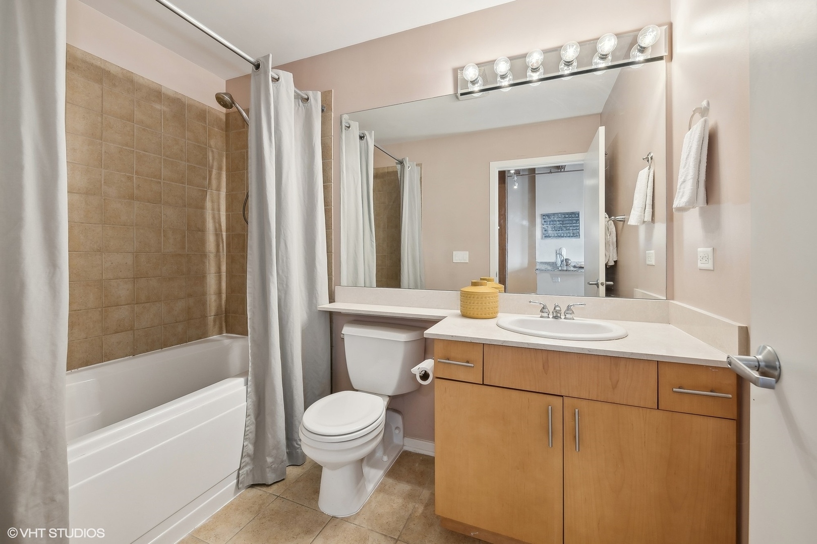 1040 West Adams Street, Unit 457 Chicago, IL 60607 - Photo 12 of 21 a bathroom with a sink toilet and shower