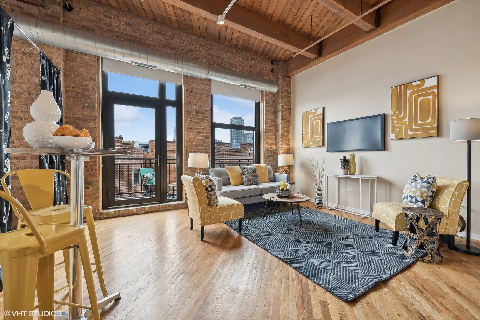 1040 West Adams Street, Unit 457 Chicago, IL 60607 - Photo 2 of 21 a living room with furniture and a flat screen tv