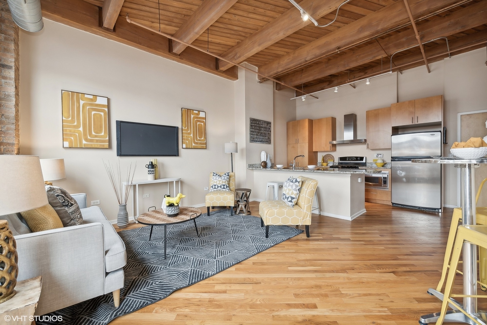 1040 West Adams Street, Unit 457 Chicago, IL 60607 - Photo 7 of 21 a living room with furniture and a flat screen tv