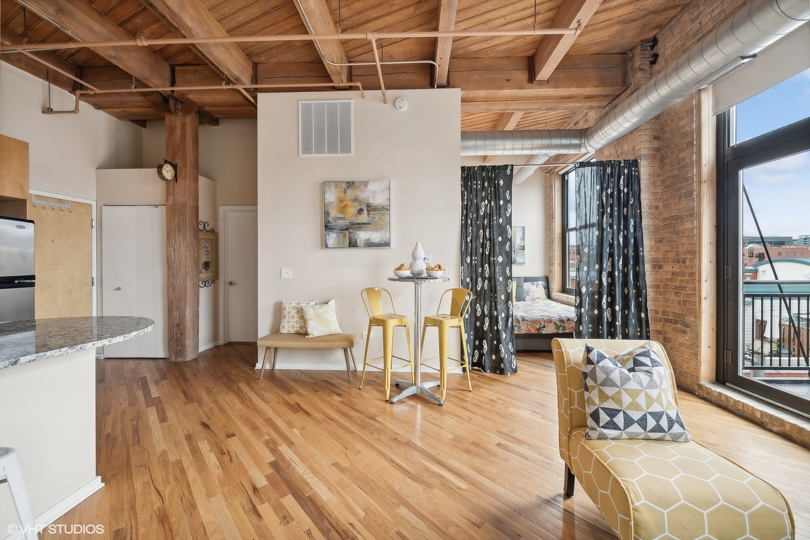 1040 West Adams Street, Unit 457 Chicago, IL 60607 - Photo 10 of 21 a living room with furniture and a wooden floor