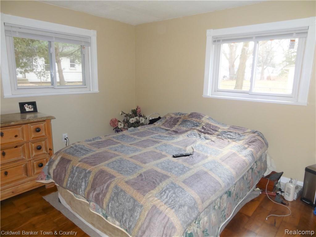 223 Ruppert Street Commerce Township, MI 48382 - Photo 23 of 31 Second bedroom - hardwood floors and great windows.