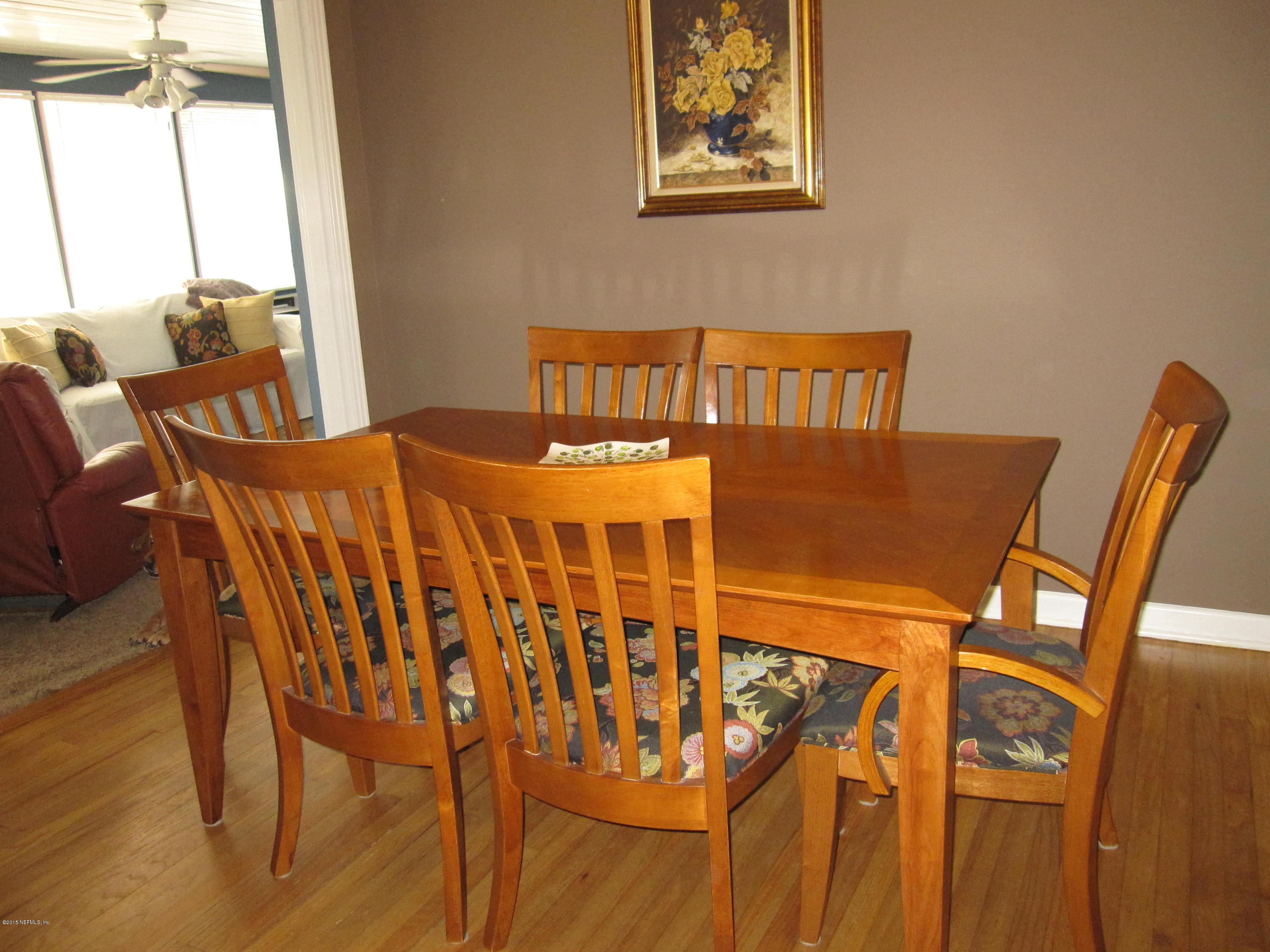 6416 Wesleyan Road Jacksonville, FL 32217 - Photo 17 of 35 a view of a dining room with furniture and a window