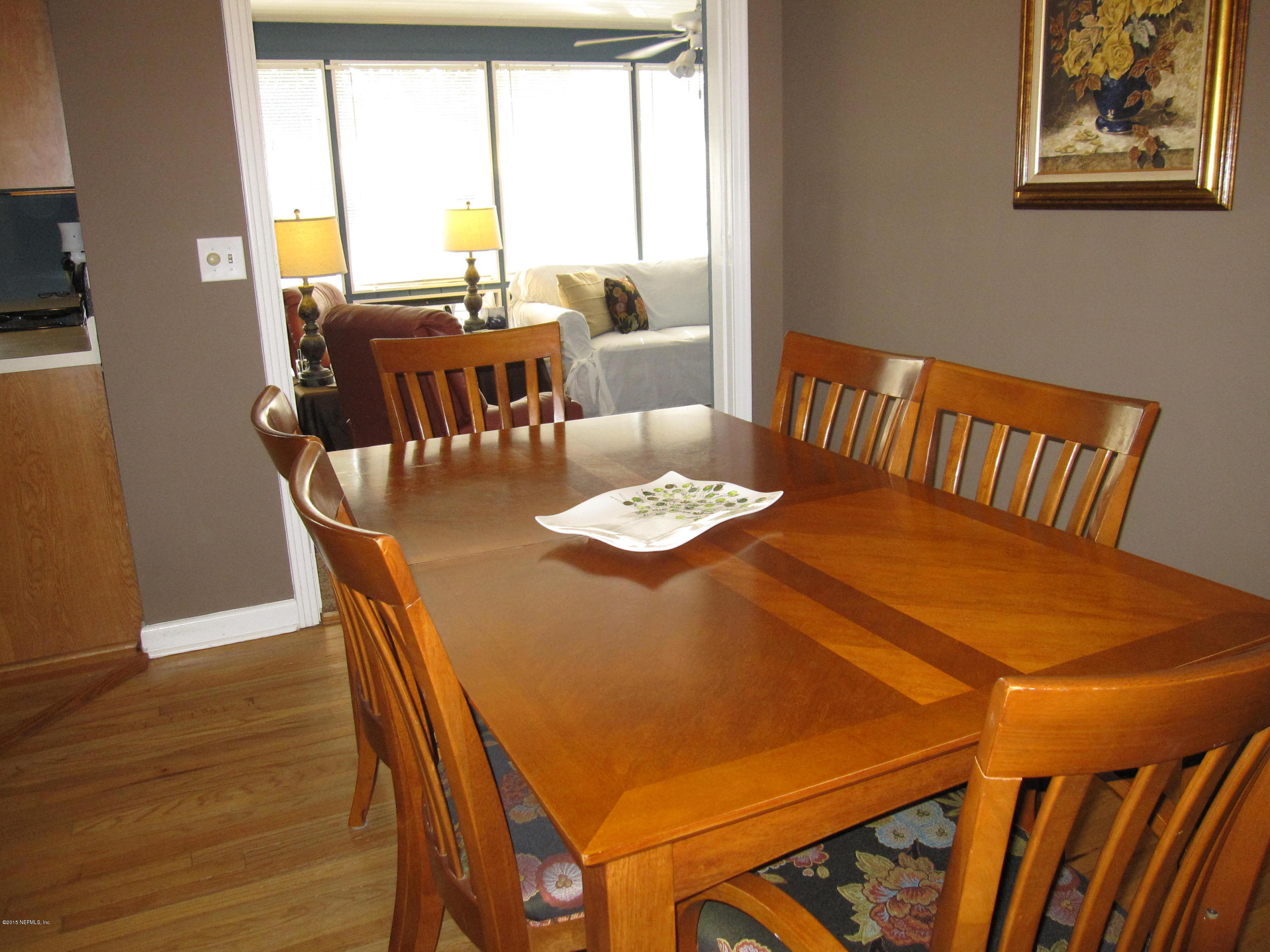 6416 Wesleyan Road Jacksonville, FL 32217 - Photo 18 of 35 a view of a dining room with furniture window and wooden floor