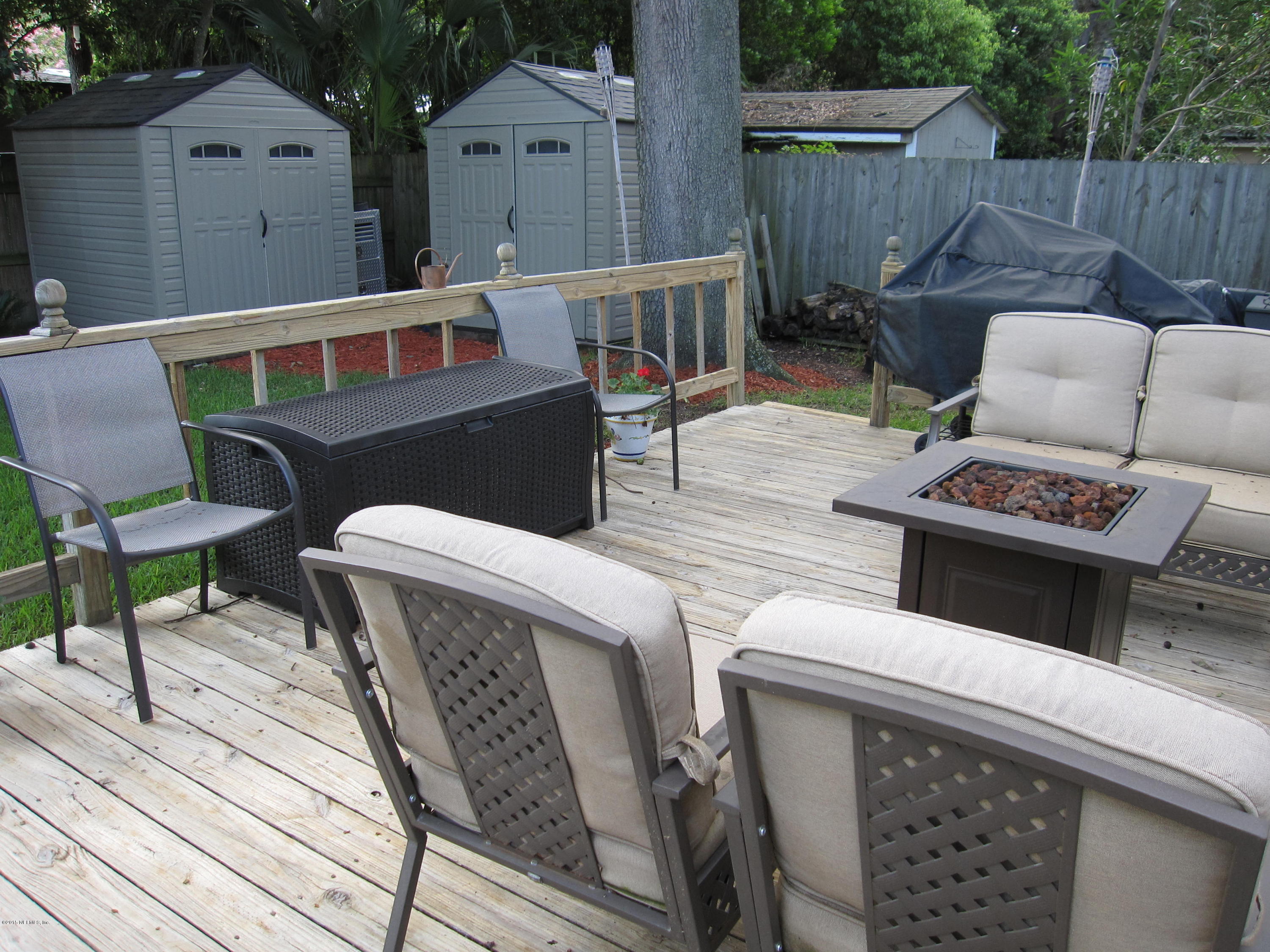 6416 Wesleyan Road Jacksonville, FL 32217 - Photo 28 of 35 a view of a chairs and table in the patio