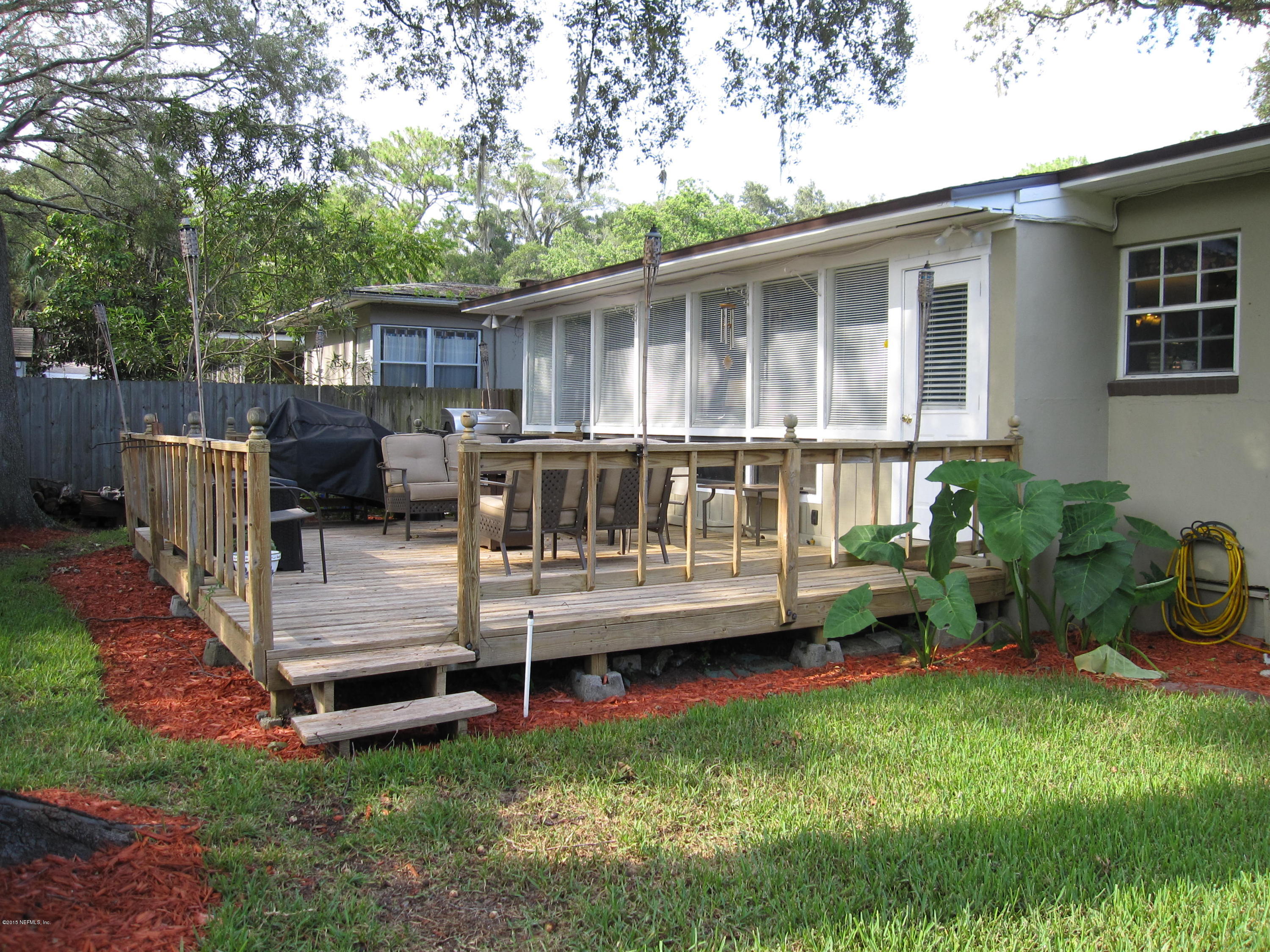 6416 Wesleyan Road Jacksonville, FL 32217 - Photo 29 of 35 a view of a house with a backyard and sitting area
