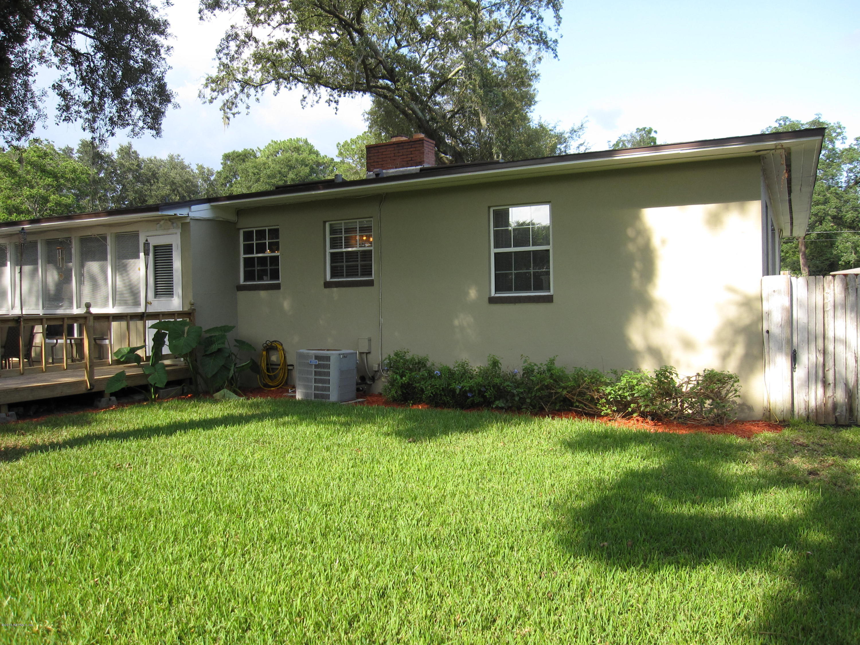 6416 Wesleyan Road Jacksonville, FL 32217 - Photo 31 of 35 a view of backyard with barbeque grill and plants