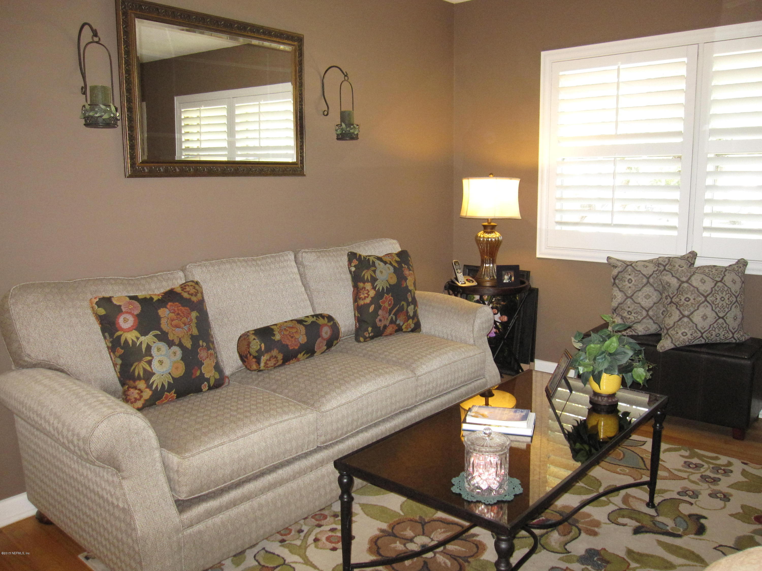 6416 Wesleyan Road Jacksonville, FL 32217 - Photo 5 of 35 a living room with furniture and a window