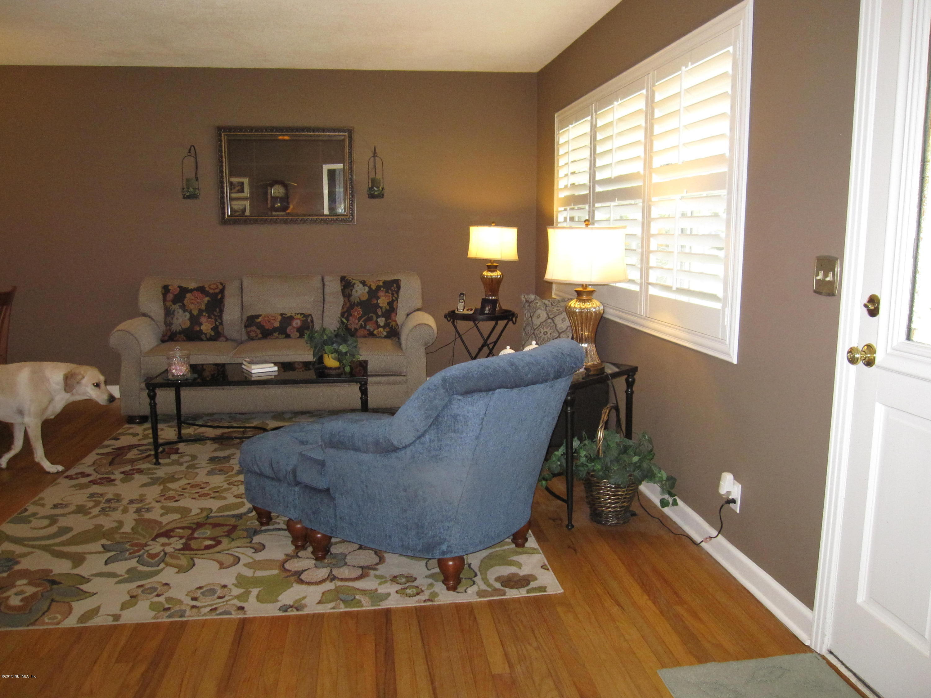 6416 Wesleyan Road Jacksonville, FL 32217 - Photo 6 of 35 a living room with furniture and a rug