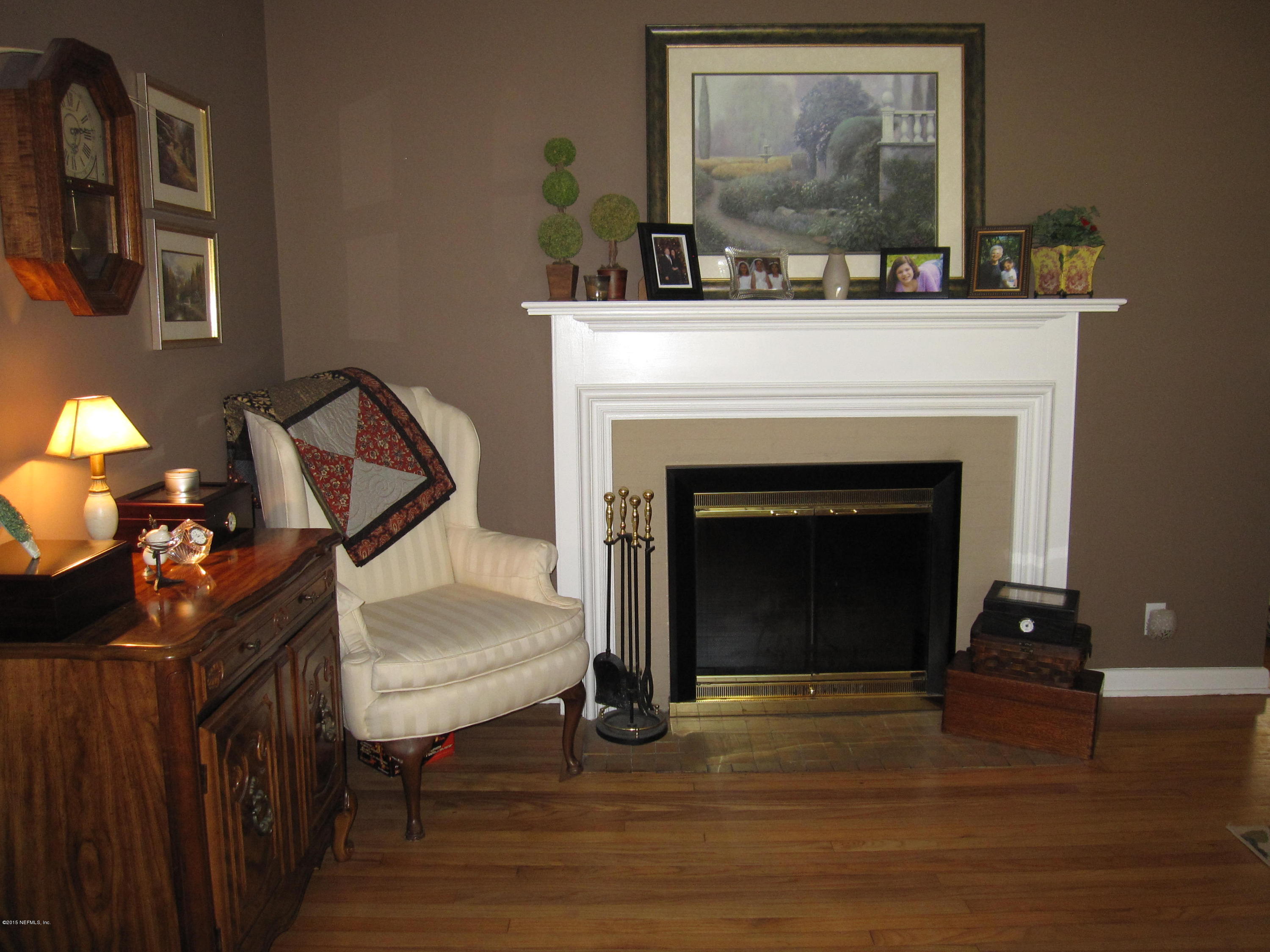 6416 Wesleyan Road Jacksonville, FL 32217 - Photo 8 of 35 a living room with furniture and a fireplace