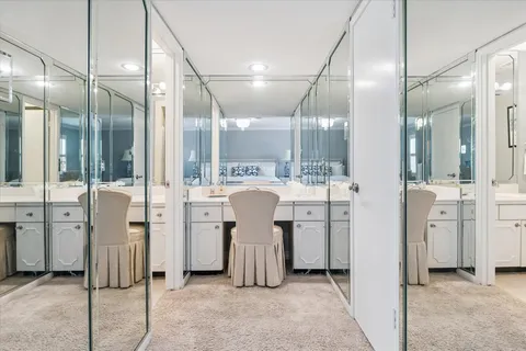 a bathroom with a glass shower door and a sink