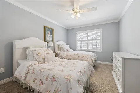 a bedroom with double bed and a window