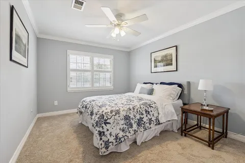 a bedroom with bed and a window